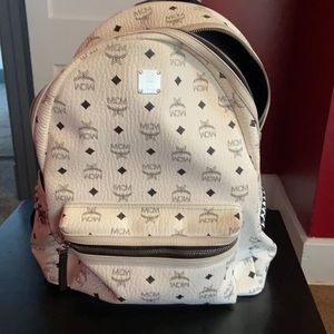 Mcm book bag with pillow case for cover.